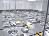 Engineers installing Deiiang 1175x575mm FFU in ISO Class 5 cleanroom ceiling grid.jpg